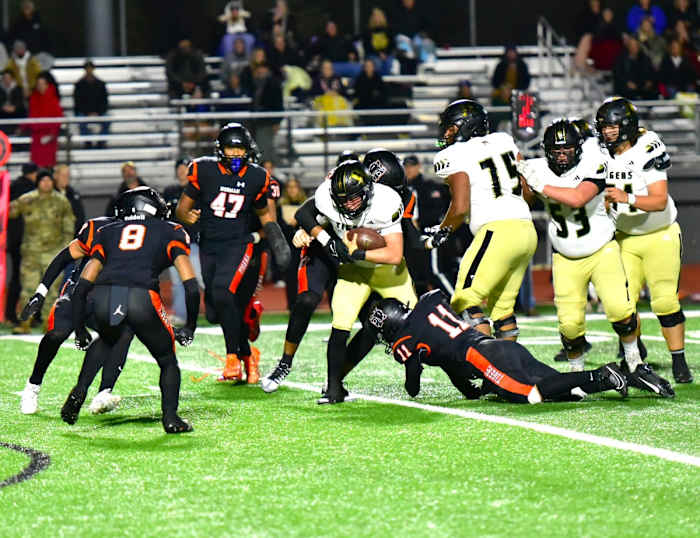 Norman defenders converge on a Broken Arrow ballcarrier during the opening round of the Class 6AI playoffs Nov. 9, 2023.